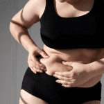 front-view-woman-holding-her-belly