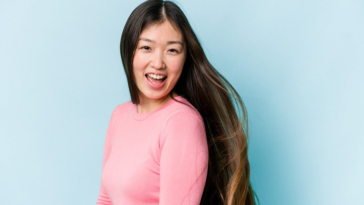 Asian woman with long, flowy hair after undergoing stem cell therapy in Malaysia
